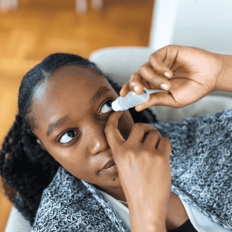 Woman using eye drop